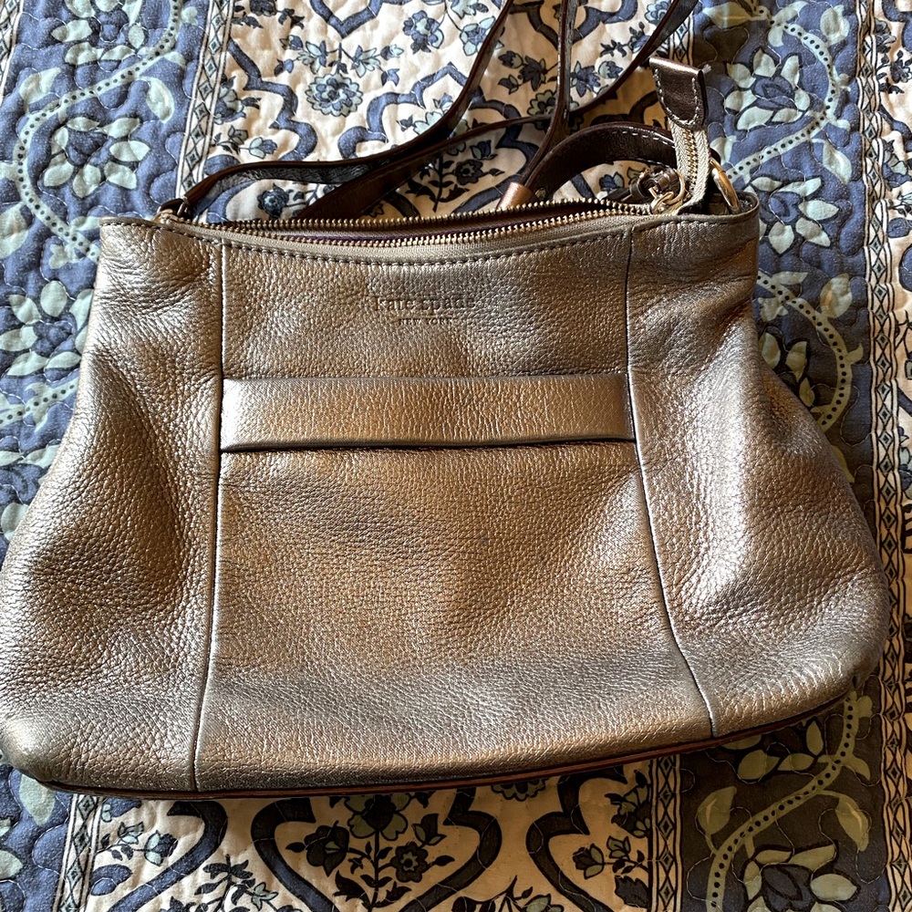 Kate Spade leather Crossbody in a metallic gun metal color.